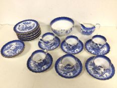 A late 19thc Willow pattern Spode teaset including six teacups (6cm x 7.5cm), nine saucers, ten side