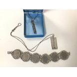 A 1970s Sheffield silver ingot, stamped with Queen's head, on silver chain (combined: 19.83g),