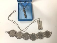 A 1970s Sheffield silver ingot, stamped with Queen's head, on silver chain (combined: 19.83g),