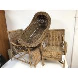 Two 1930s/40s children's wicker chairs including a garden lounger style chair and a baby's basket