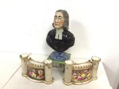 A 19thc. ceramic bust of the Reverend Wesley, on footed base, some losses and damage (29cm) and a