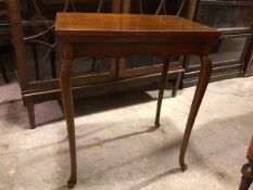 An Edwardian mahogany card table, the rectangular top with boxwood and ebony strung border,