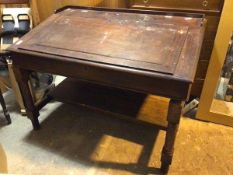 An early 20thc mahogany drafting table, the hinged sloped front over an arrangement of pigeonholes