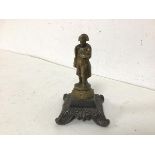 A brass figure of Napoleon on acanthus leaf footed base (10cm)