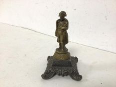 A brass figure of Napoleon on acanthus leaf footed base (10cm)
