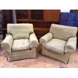 A pair of John Lewis armchairs in green linen upholstery, with rolled arms, on circular feet (