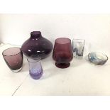 A collection of amethyst glass including a squat vase (18cm x 23cm), a vase on footed base, a