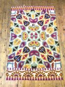 A Kashmiri wool hand chain stitched rug with naturalistic design in polychrome colours (143cm x