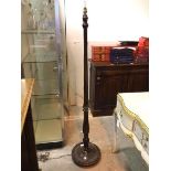 A floor lamp with turned reeded stem on dished base with beaded edge (160cm)