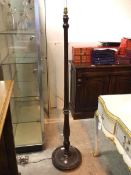 A floor lamp with turned reeded stem on dished base with beaded edge (160cm)