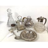 An assortment of Epns and glassware including condiment set on stand, wine jug, decanter, teapot and