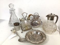 An assortment of Epns and glassware including condiment set on stand, wine jug, decanter, teapot and