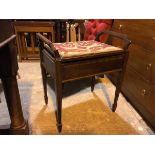 A 1930s/40s piano stool, with raised handles to sides, with hinged top and plain frieze, on tapering