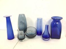 A collection of blue and grey glass including a tapering vase with etched floral decoration (19cm