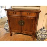 A Chinese elm cabinet, first half of 20thc. with exposed tenons and bronze mounts (106cm x 107cm x