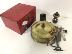 A 1940s/50s portable Primus stove, complete with red travelling case (12cm x 19.5cm x 17cm)