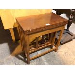 A teak extending table with a lift and fold mechanism and concertina style support (open: 54cm x