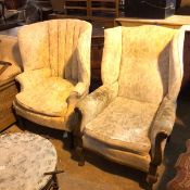 A lady's and gentleman's armchair with scroll arms and in a foliate upholstery (a/f), on cabriole