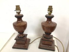 A pair of wooden table lamps of urn form on plinths, with painted stone effect (32cm to top of