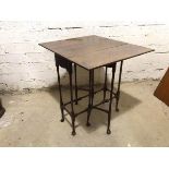 A 1920's Georgian style drop leaf occasional table, the rectangular top on turned supports with