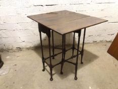 A 1920's Georgian style drop leaf occasional table, the rectangular top on turned supports with