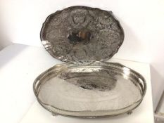 An oval drinks tray with raised pierced edge and handles to side, on claw feet (7cm x 6cm x 31cm)