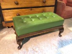 A Georgian style footstool, with green vinyl buttoned top on cabriole supports ending in pad feet,