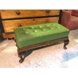 A Georgian style footstool, with green vinyl buttoned top on cabriole supports ending in pad feet,