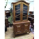 A French Swiss walnut and chequer banded bookcase cabinet, first half of the 20thc., the arched