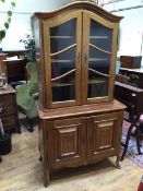 A French Swiss walnut and chequer banded bookcase cabinet, first half of the 20thc., the arched