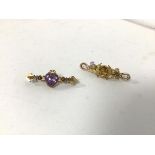 A 15ct gold bar brooch with heart cut amethyst (4.5cm) and another yellow metal bar brooch with