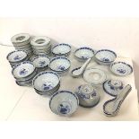 A set of blue and white Chinese rice grain porcelain dishes including eleven rice bowls, twelve