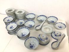 A set of blue and white Chinese rice grain porcelain dishes including eleven rice bowls, twelve