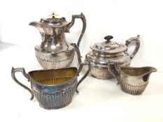 An Epns set of coffee or hot water jug, milk jug and sugar bowl, with gadrooned base (jug: 21cm) and