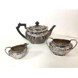 An 1894 Sheffield silver teapot with matching milk jug and two handled sugar bowl, all with makers