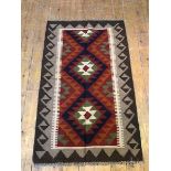 A Maimana kelim rug, with diamonds within a tan and brown running dog border (129cm x 80cm)