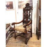 An unusual rosewood open armchair, second half of 19thc., probably Colonial, the back carved with