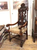 An unusual rosewood open armchair, second half of 19thc., probably Colonial, the back carved with
