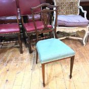 An Edwardian rosewood bedroom chair with inlaid shield back and pierced vase shaped splat, above