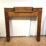 A 1930s mahogany fire surround with sunken shelf to top (126cm x 128cm x 17cm)