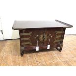 A Chinese simulated elm table cabinet with pagoda top and engraved brass lock plate and hinges (45cm