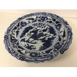 A mid 20thc or later Chinese blue and white charger with scalloped rim and mythical horse to well (