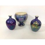 A 1920s/30s Crown Devon lustre ware, including a footed vase and two baluster vases (16cm) (3)