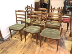 A set of six G Plan elm dining chairs with ladderbacks and olive green upholstered seats, on