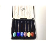 A set of six 1920s silver and enamelled coffee bean spoons in original J.A. Ramsay, Dundee box (