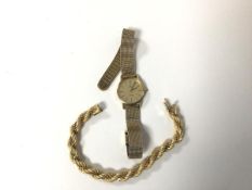 A rope link bracelet entwined with a white metal chain, marked Brev, 750 (open: 18cm) (18.52g) and a