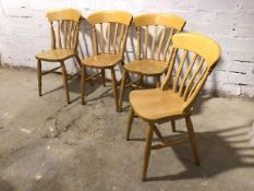 A set of four beech dining chairs, stamped The Pine People, to base, all on turned supports with H