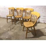 A set of four beech dining chairs, stamped The Pine People, to base, all on turned supports with H
