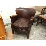 A John Lewis studded brown leather low chair, with scroll arms with seat cushion, on straight square