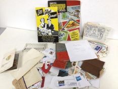 Stamp interest: a collection of loose and used stamps, paperback stamp album and stamp collecting